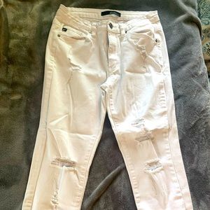 Distressed white skinny jeans